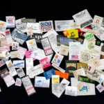 A bunch of business cards are all piled up